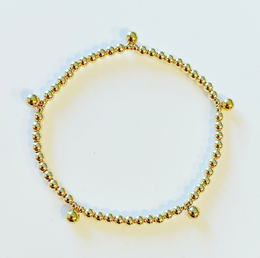 Gold Bracelet with Dangling Ball Details